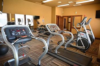 Gym with cardio equipment Bella on Canyon Apartments in Puyallup Wa